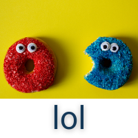 Two donuts on a yellow background. One donut is covered in red coconut, and the other in blue. Both have eyes, and the donut holes appear to be surprised mouths. The blue donut has a bite taken out of it.